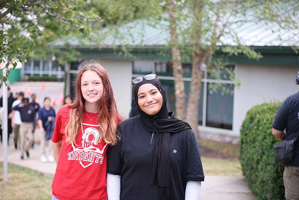 students and teacher working in classroom