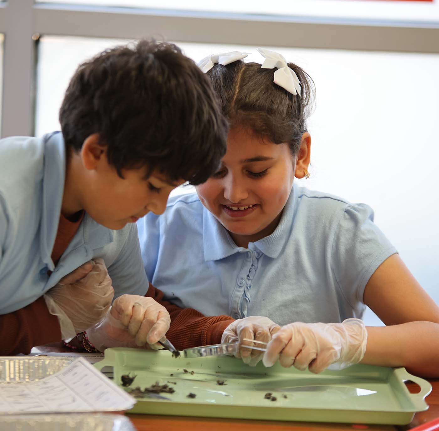 Noble Academy Euclid student drawing at a desk in a classroom setting