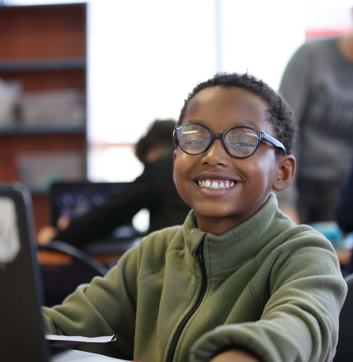 Student drawing in a classroom.