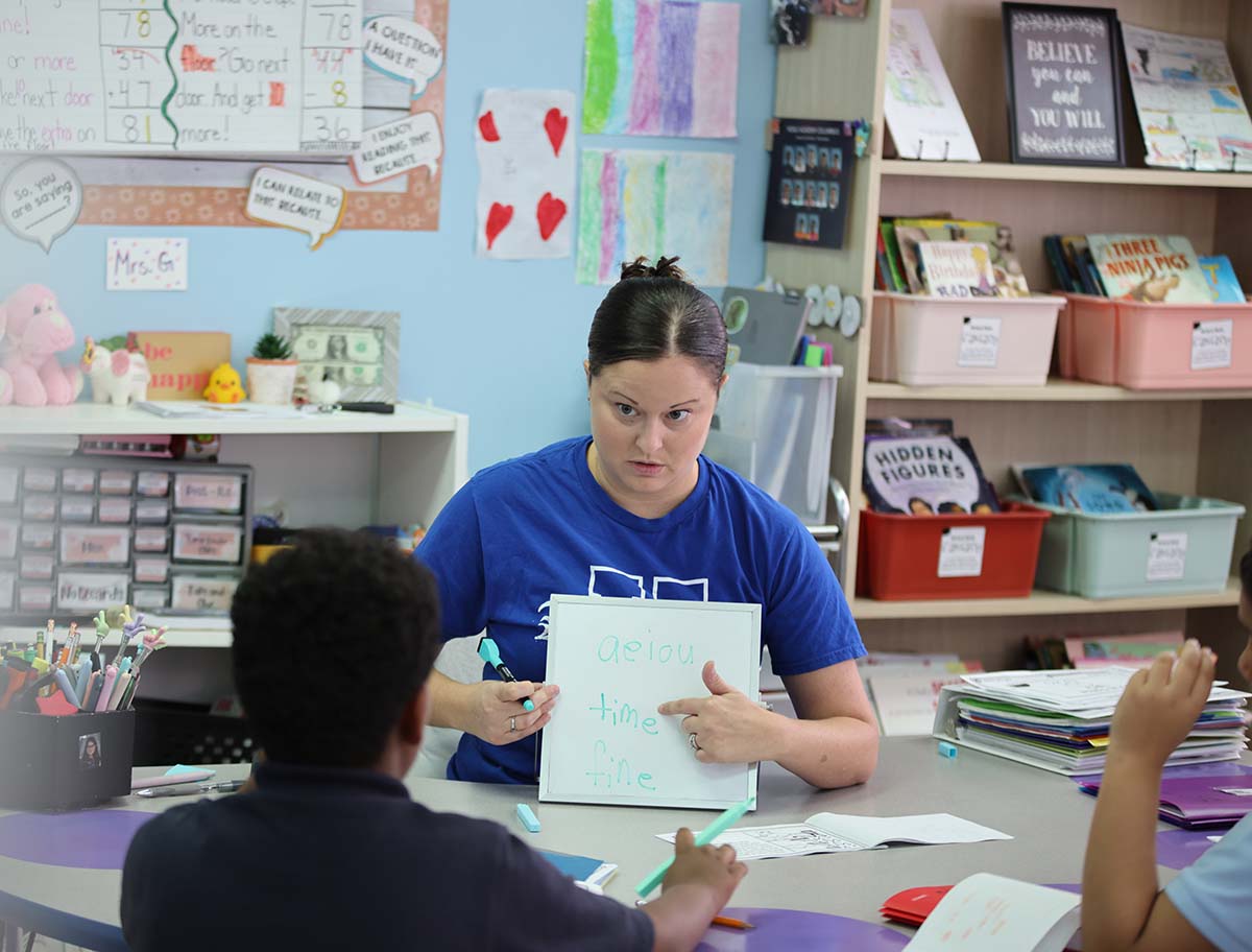 Noble Academy Euclid Teacher smiling.